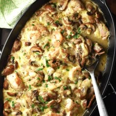 a casserole dish with chicken, mushrooms and cheese