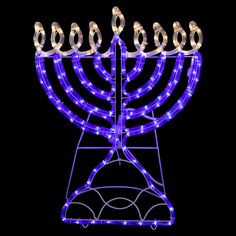 the menorah is lit up with blue lights and has five candles on it