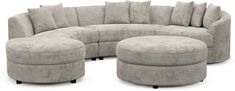 a large sectional couch and ottoman with pillows on the bottom, in front of a white background