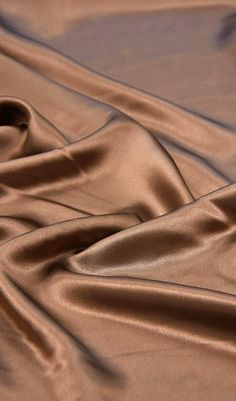 a close up view of a brown satin fabric