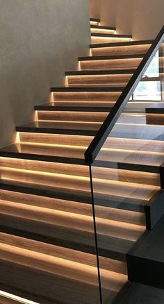 some stairs with lights on them in a building