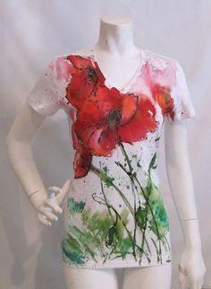 a white mannequin with red flowers painted on it's chest and back