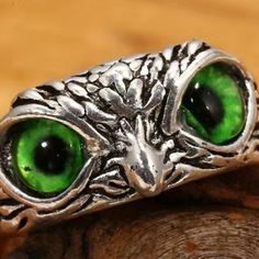 Green Eyed Silvertone Owl Ring Adjustable. New, Never Worn. Costume Jewelry Casual Silver Ring, Batman Ring, Owl Eyes Ring, Owl Necklaces, Barn Owl Necklace, Owl Ring, Owl Jewelry Necklace, Shark Tooth Necklace, Elephant Jewelry