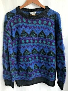 H&M Mohair Blend Knit Sweater Size: MEDIUM Measurements: When led flat, across the Front, pit to pit - approx 23" Length: Front Shoulder to Hem - approx 27"  Multi-Color Mohair Blend Pullover sweater Blue, Purple, Black, Teal Geometric Design Black Trim around neckline, cuffs and hemline Long Sleeves  Great Colors and Design CONDITION: Pre-owned - Very Good Clean Vintage Condition Please look at all photos as they are part of the Description Please Ask any Questions, I will try and answer as qui Casual Blue Mohair Sweater, Ski Vibes, 2024 Lookbook, Random Clothes, Retro Ski, Teal Sweater, Grandpa Sweater, Purple Teal, Black Trim