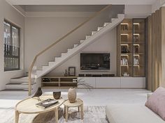 a living room filled with furniture and a staircase