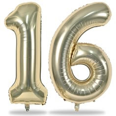 the number six is made out of gold foil and has a large balloon like shape