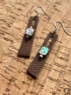 the earrings are made with leather and beads