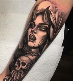 a woman with horns and skulls on her arm is depicted in this tattoo design by artist mike