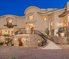 a large house that has stairs leading up to it