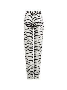 Alaïa's Tiger Print Jeans feature an all-over, black and white animal print on a high-waisted, straight cut denim pant. They are completed with a zip and button fastening. Pair with the matching trench coat to complete the look.[tab] Composition: 100% Cotton Denim Size and Fit: Runs True to Size Care Instructions: Dry Clean Only Origin: Made in Italy SKU: AZZ49P04 Questions about size, fit, or how to style? The KZ team is here to help you look and feel your best! Chat with our stylists via the i Tiger Print Outfits, Tiger Outfit, Zebra Print Pants, Black Tiger, Azzedine Alaia, Print Jeans, White Zebra, Printed Jeans, White Tiger