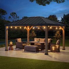 a gazebo lit up with string lights in the evening