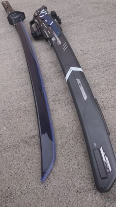 two skis laying on the ground next to each other