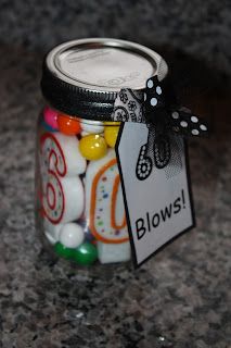 a jar filled with lots of candy sitting on top of a counter