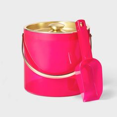 a bright pink ice bucket and shovel set