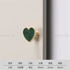 an image of a door handle with a green heart on the front and back side