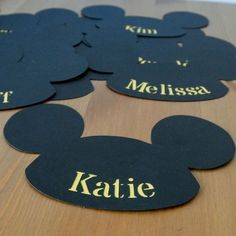 mickey mouse name tags on a wooden table