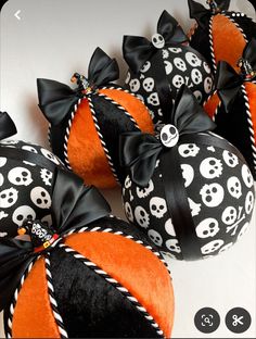 halloween decorations with skulls and bows on them