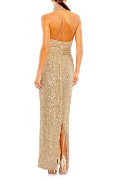 Drenched in effervescent sequins and styled to showcase your shoulders, this gilded gown will get glasses raised. 63" length Halter neck Sleeveless, with cutaway shoulders Lined 100% polyester Spot clean Imported Champagne Sequin Dress, Sequined Fabric, Wide Leg Jeans Cropped, Sequin Halter, Sheath Gown, Mac Duggal Dresses, Halter Gown, Column Gown, Fur Coats Women