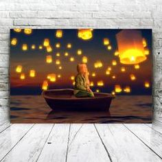 a woman sitting in a boat with floating lanterns