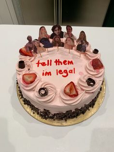 there is a cake with pictures on it and the words tell them i'm legal