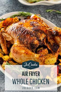 an air fryer whole chicken on a plate with potatoes