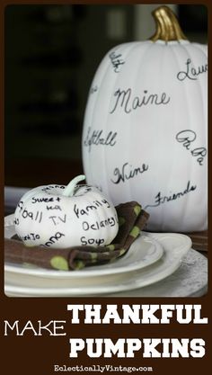 a white pumpkin sitting on top of a plate next to a knife and fork with writing on it