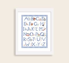 a cross stitch alphabet pattern in blue and white