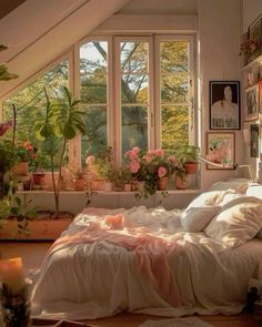 a bedroom with lots of plants in the window sill