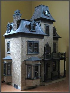 the doll house is made out of cardboard