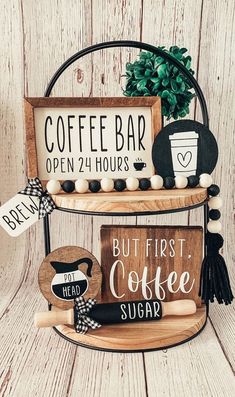 two tiered shelves with coffee signs and other items on top of each shelf in front of a wooden wall