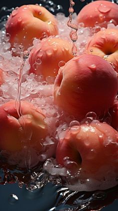 apples are being washed in water with bubbles