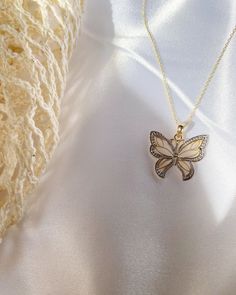 Give her the gift of wings with this beautiful butterfly necklace. DETAILS - 14k yellow gold butterfly with rhodium plating - Chain option is a 14k yellow gold cable chain - Chain style may vary slightly - Approximately 3/4 inch wide x 3/4 inch tall (including bail) VARIATIONS If you require any variation of this style (a different style chain, longer chain, etc.) feel free to message us. We will do our best to accommodate you. Additional costs may apply depending on the variation. POLICY We do Elegant Butterfly Jewelry As A Gift For Her, Elegant Butterfly Jewelry Gift For Her, Elegant 14k Gold Butterfly Jewelry, Silver 14k Gold Jewelry With Butterfly Charm, 14k Gold Jewelry With Silver Butterfly Charm, Yellow Gold Wing-shaped Jewelry, Elegant Wing-shaped Jewelry As Gift, Elegant Wing-shaped Jewelry Gift, Fine Jewelry Gold Butterfly Charm