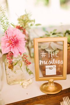 an image of a table with flowers and a sign that says, the missings