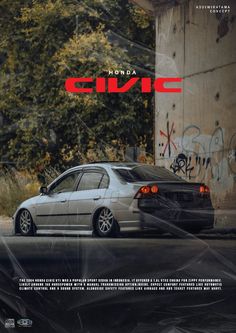 a white car parked in front of a graffiti covered wall