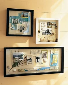 two black framed pictures hanging on the side of a wall