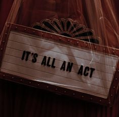 it's all an act sign attached to the back of a plastic bag that says it's all an act