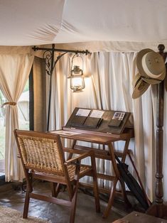 a chair and table in a room with curtains