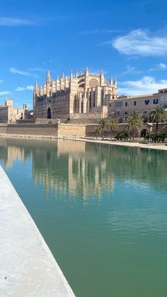 a large building sitting next to a body of water