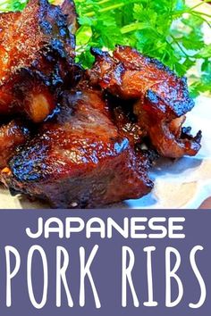 japanese pork ribs on a plate with garnishes and parsley in the background