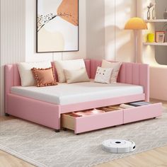 a living room with a pink couch and white rugs on the floor next to a wall