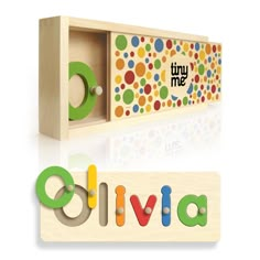 a wooden block with the word livva printed on it and an image of a toy