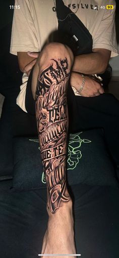 a man's leg with some writing on it