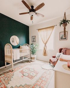 a baby's room with a crib, chair and rug in the corner