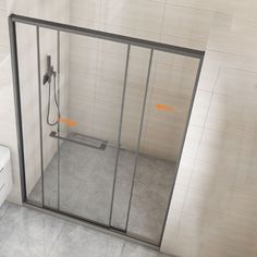 a bathroom with a glass shower door and toilet next to the wall in front of it