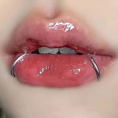 a woman's lips with white writing on the top and bottom part of her lip