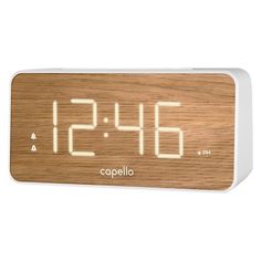 the alarm clock is made from wood and has white leds on it's face