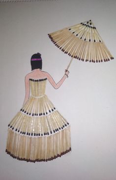 a woman in a dress holding an umbrella made out of straws on the wall