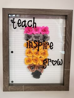 a frame with flowers on it that says teach inspire grow in front of a white background