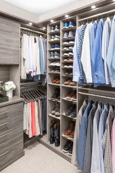 a walk in closet filled with lots of clothes