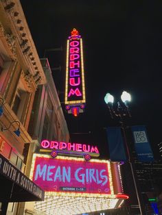 the marquee for mean girls is lit up at night